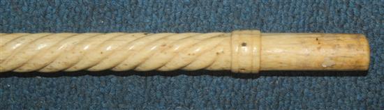 A 19th century scrimshaw carved whale bone and baleen walking cane, 39in.